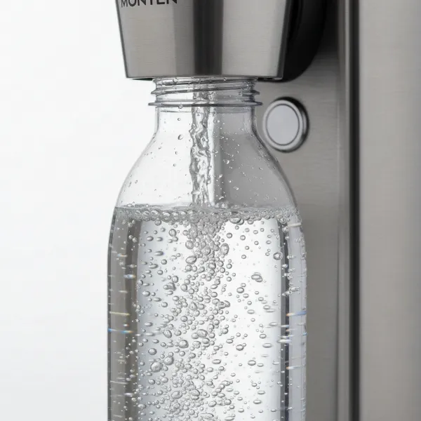 Close-up of Monten Soda Maker during carbonation process with bubbles